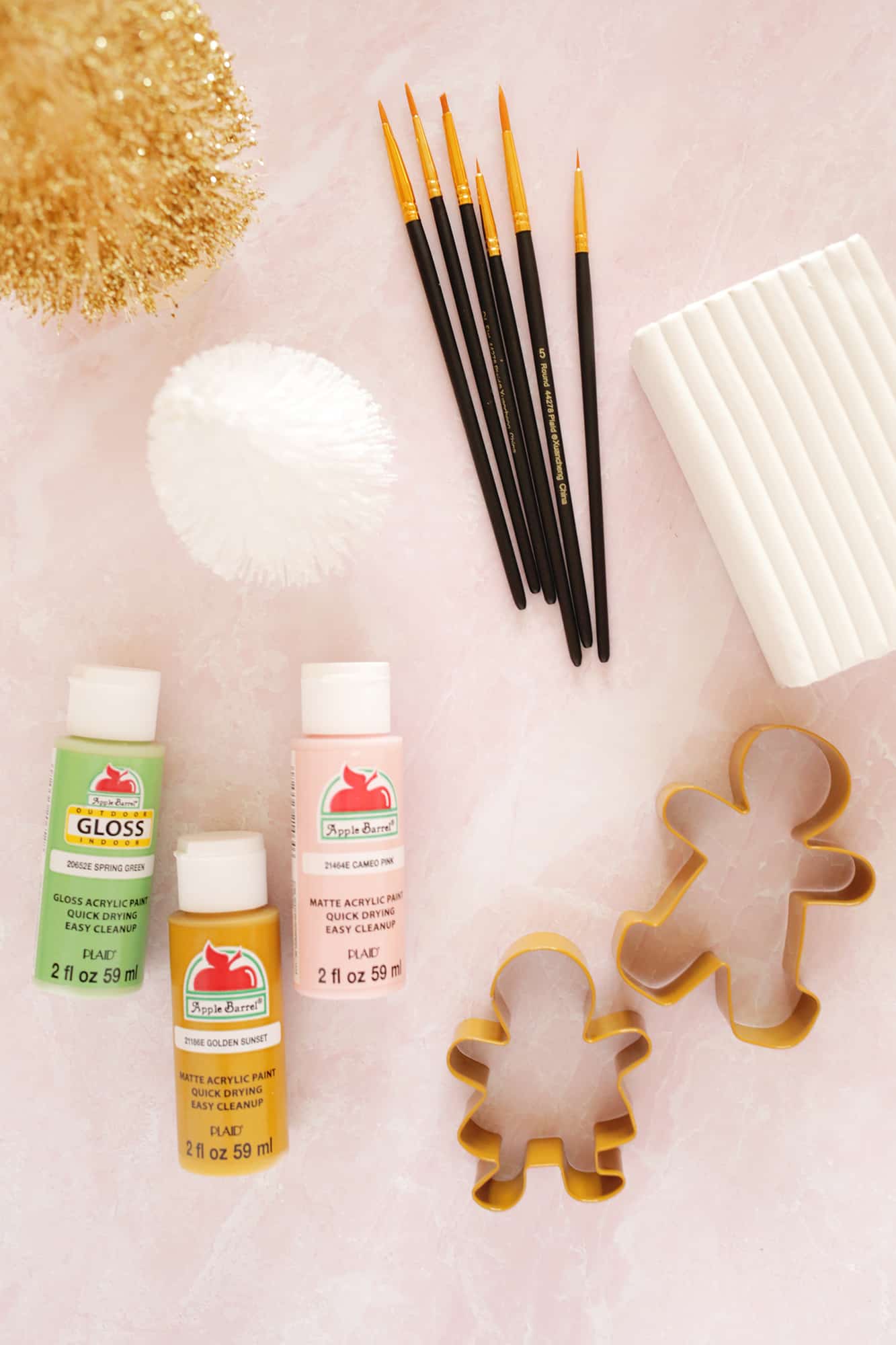 2_supplies brushes, clay, paint, and cookie cutters